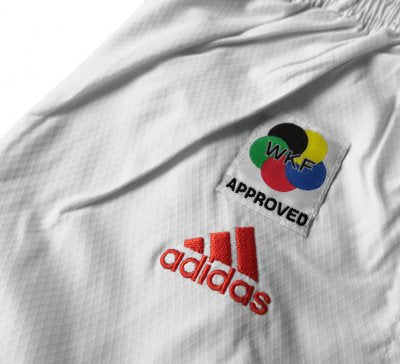 KARATEGI ADIDAS ADILIGHT PRIMEGREEN CON STRISCE ROSSE WKF